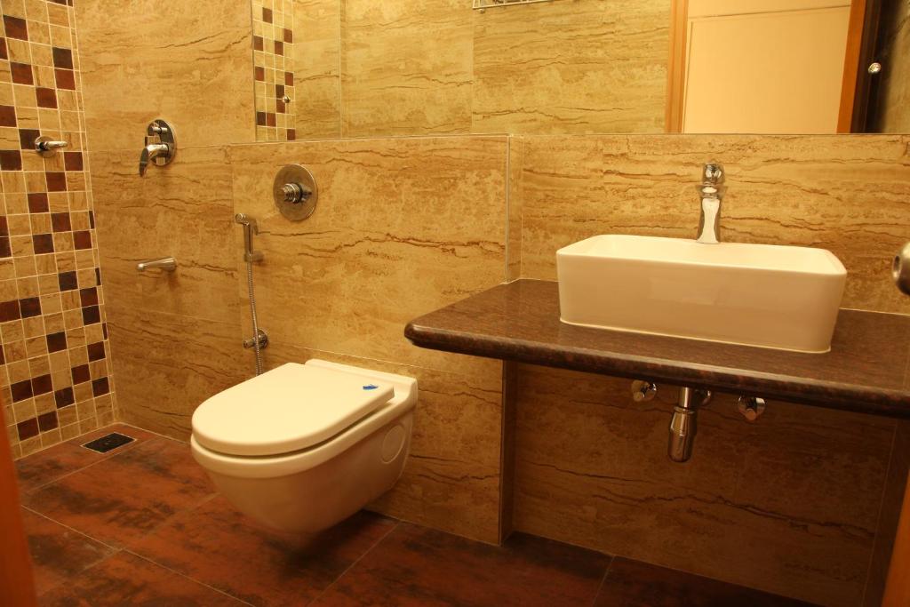 Koupelna v ubytování Hotel Ravikiran Alibaug