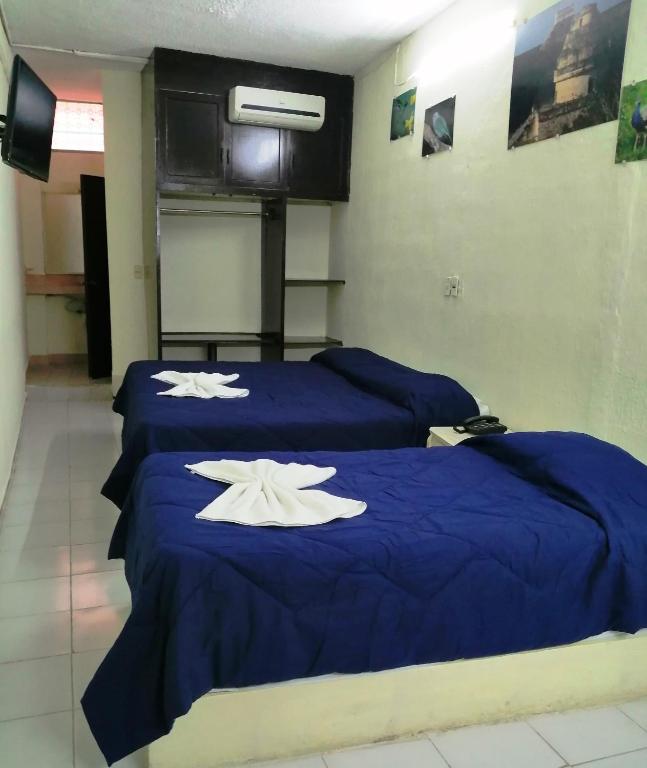 Postel nebo postele na pokoji v ubytování Hotel Suites Elia Noemi
