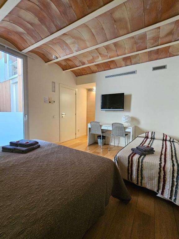 Postel nebo postele na pokoji v ubytování Hotel Can Bo De Pau