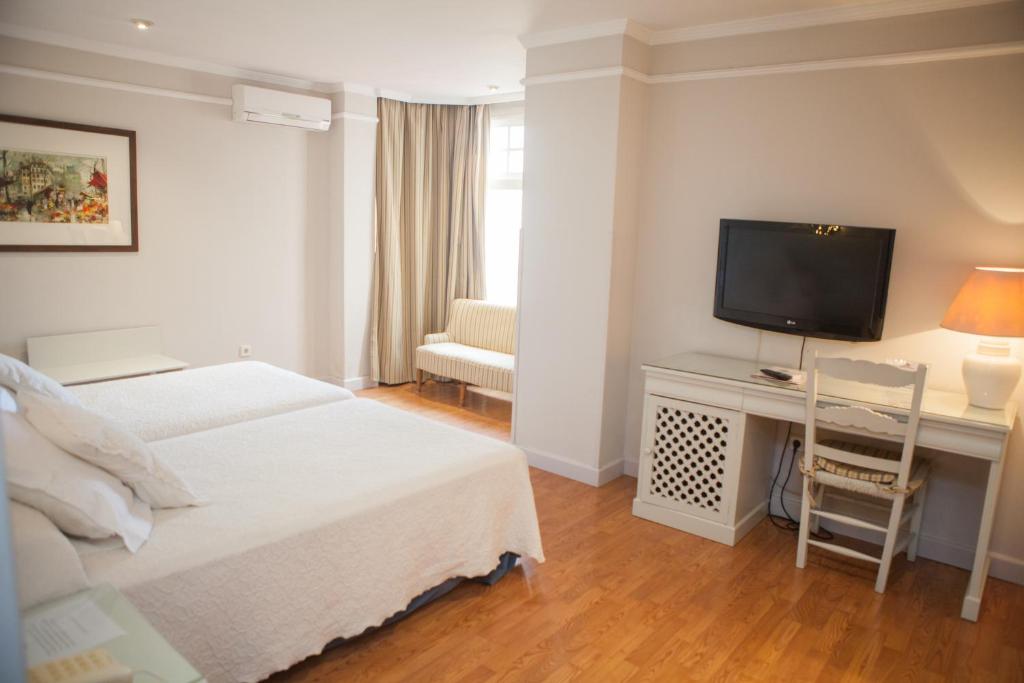 Posteľ alebo postele v izbe v ubytovaní Hotel Doña Blanca