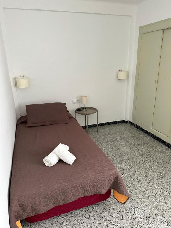 Postel nebo postele na pokoji v ubytování L'Illa Hotel