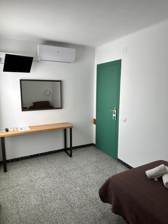 TV a/nebo společenská místnost v ubytování L'Illa Hotel
