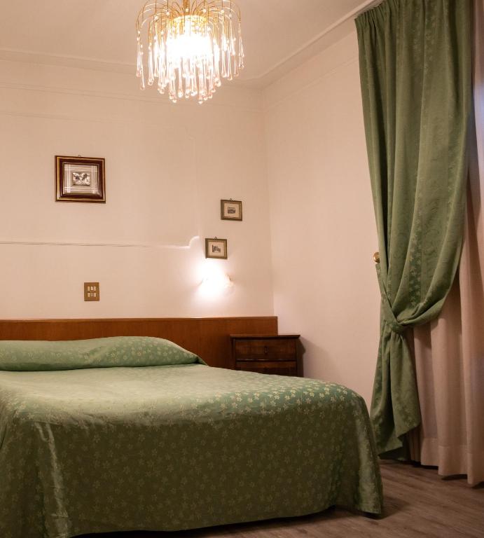 Postel nebo postele na pokoji v ubytování Hotel Park Ge.Al.