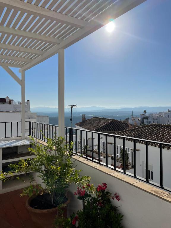 a balcony with a view of the ocean at Casa Dulce in Vejer de la Frontera