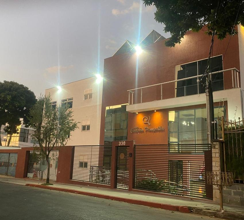 a building on the side of a street at Hotel Conexão Pampulha in Belo Horizonte