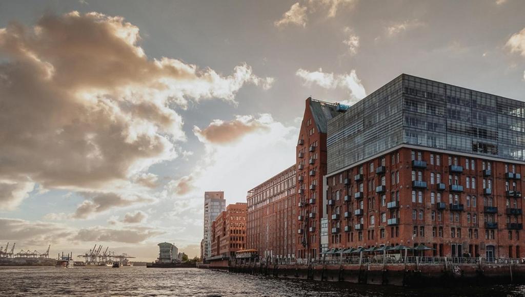 a group of buildings next to a body of water at GINN Hotel Hamburg Elbspeicher in Hamburg