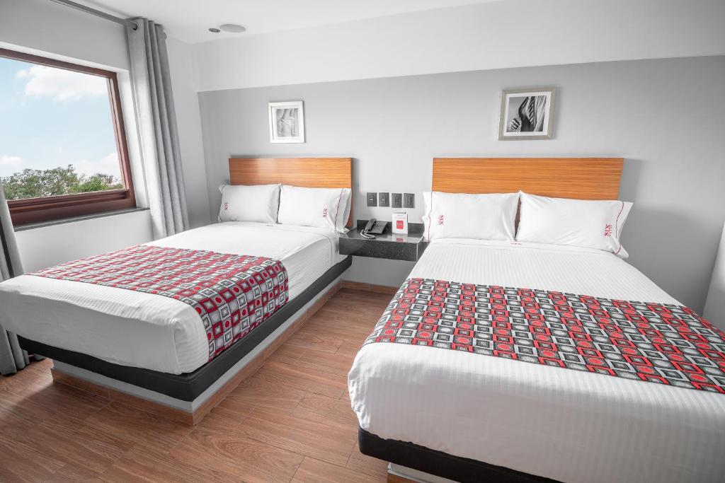 Postel nebo postele na pokoji v ubytování Six Hotel Guadalajara Expiatorio