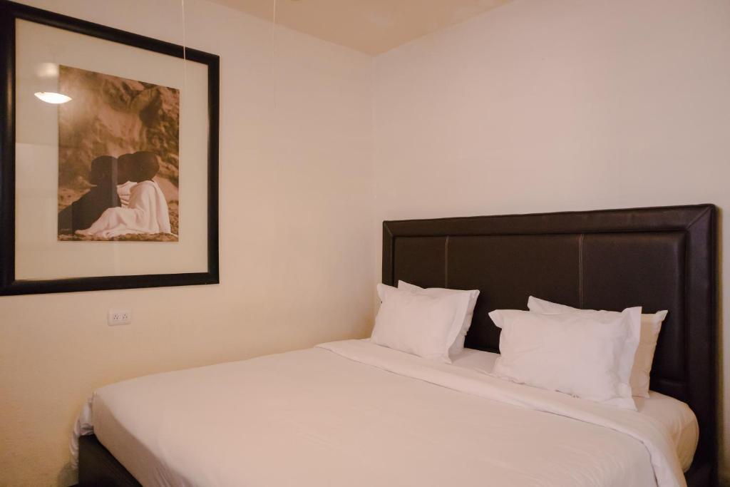 Postel nebo postele na pokoji v ubytování Hotel Del Portal San Miguel de Allende