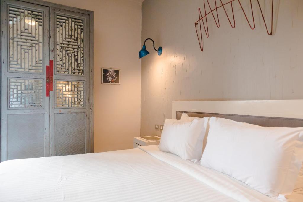 Postel nebo postele na pokoji v ubytování Hotel Del Portal San Miguel de Allende