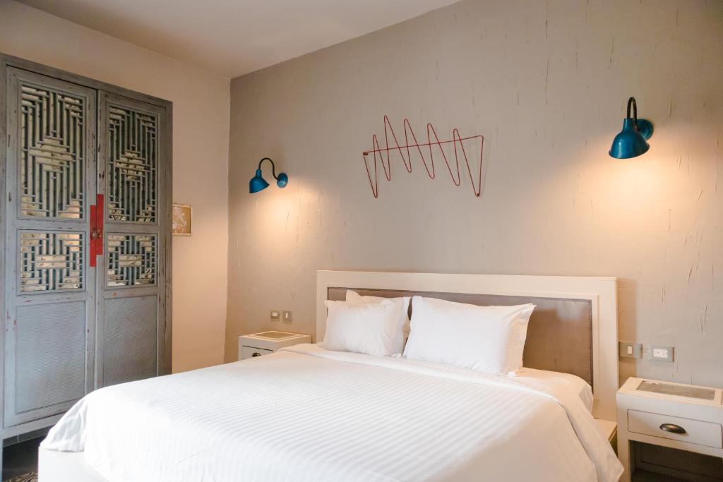 Postel nebo postele na pokoji v ubytování Hotel Del Portal San Miguel de Allende