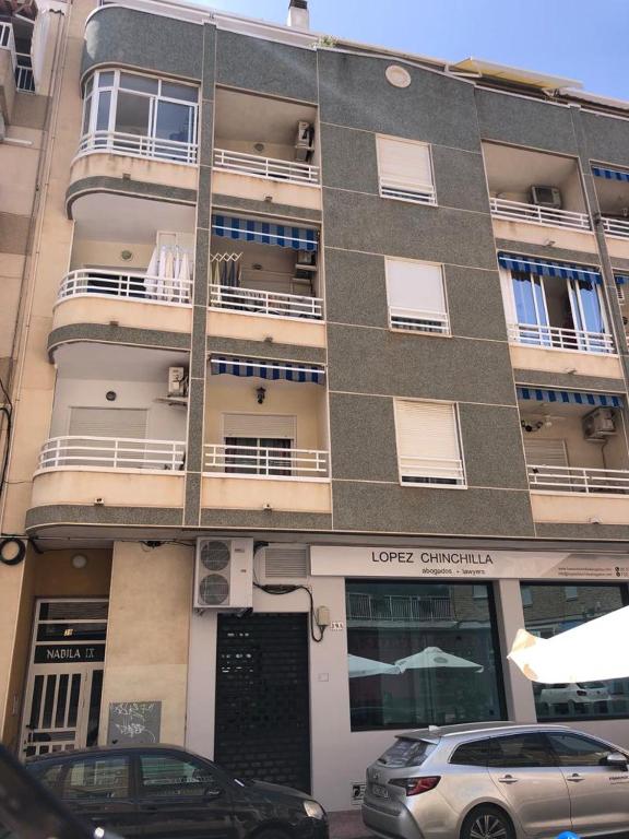 a building with cars parked in front of it at NABILA9 in Torrevieja