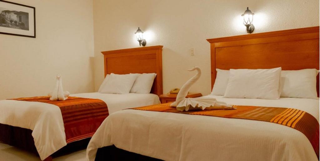 Postel nebo postele na pokoji v ubytování Los lagos de Montebello