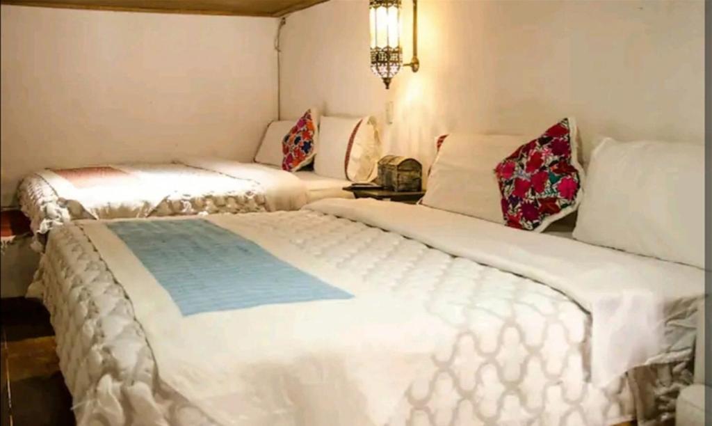Postel nebo postele na pokoji v ubytování Villas del Sol