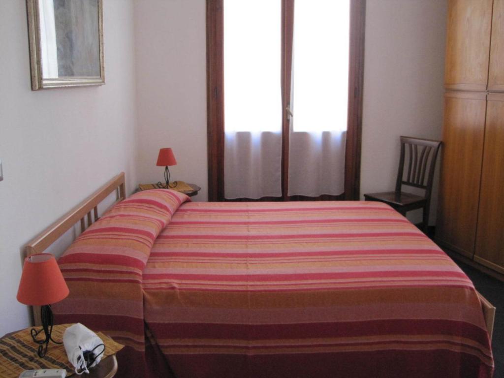 Postel nebo postele na pokoji v ubytování B&B Il Brigante