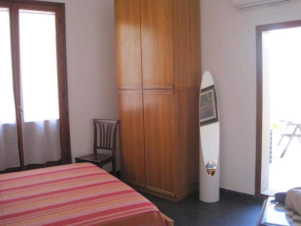 Postel nebo postele na pokoji v ubytování B&B Il Brigante