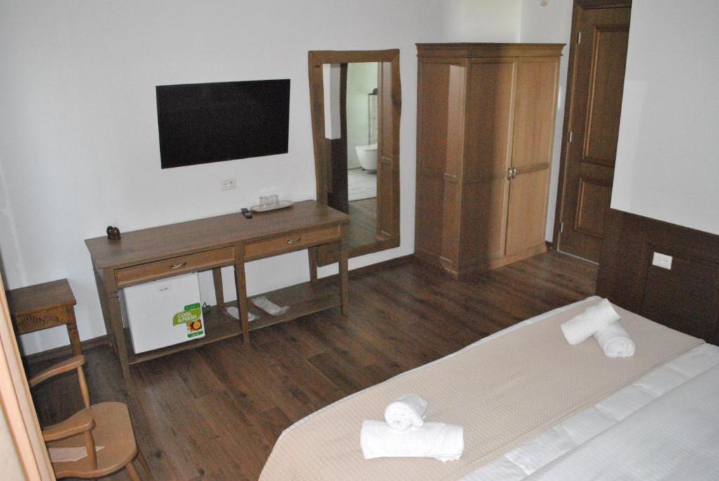TV a/nebo společenská místnost v ubytování Boutique Vila FIDANI