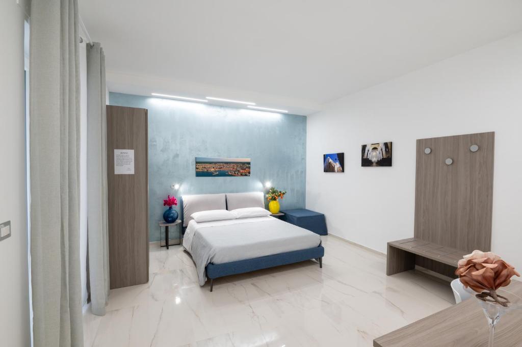 Postel nebo postele na pokoji v ubytování B&B BISCEGLIE