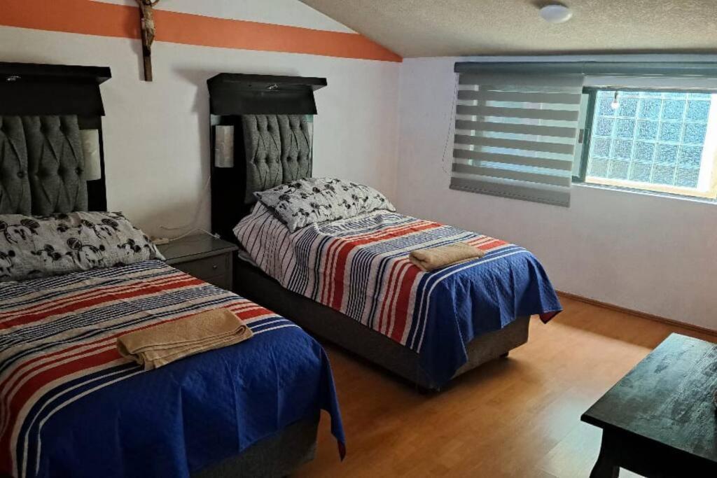 Vuode tai vuoteita majoituspaikassa Nido viajero en Toluca