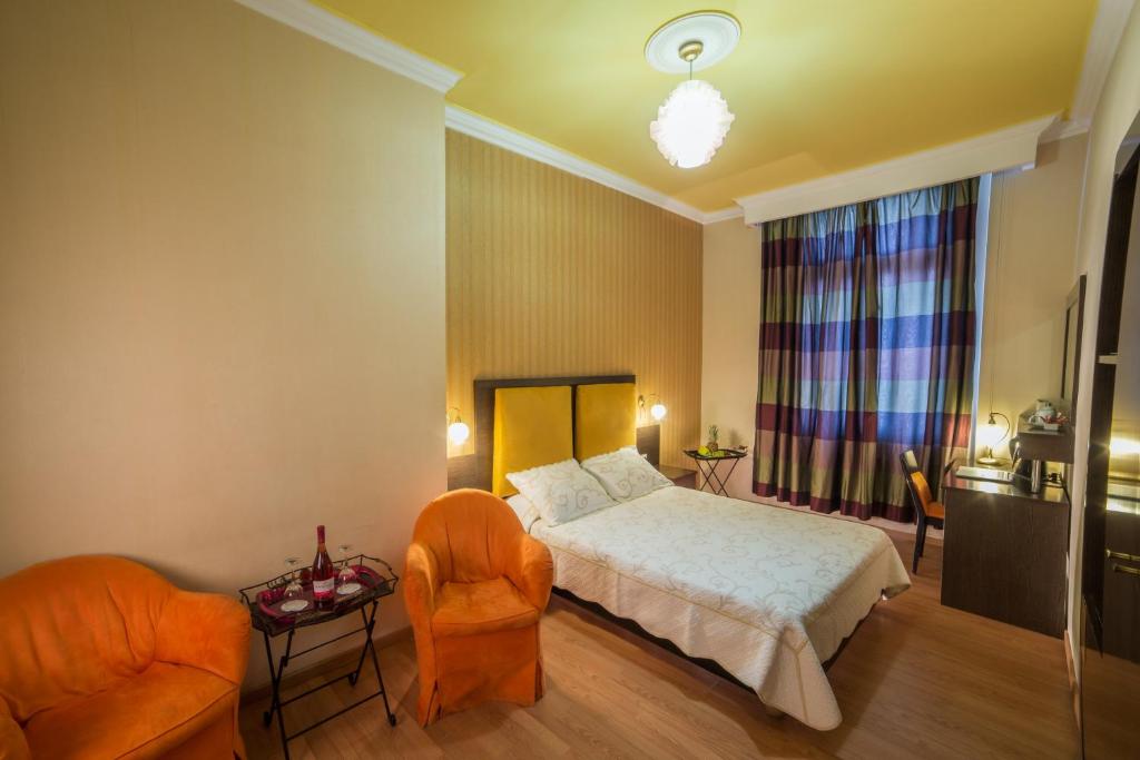 En eller flere senger på et rom på Delphi Art Hotel by Prima Hotels