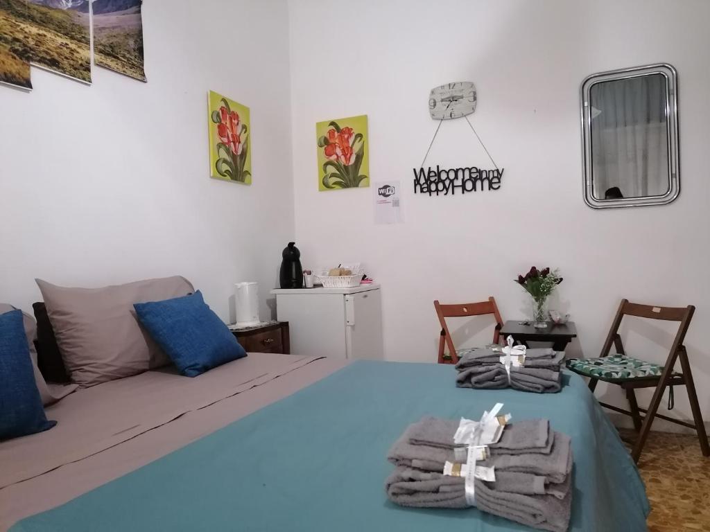 a bedroom with a bed and a table and chairs at Melissa lux in Ciampino