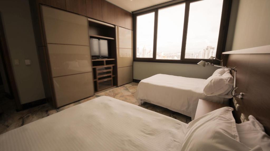 Postel nebo postele na pokoji v ubytování Torres de Alba Hotel & Suites