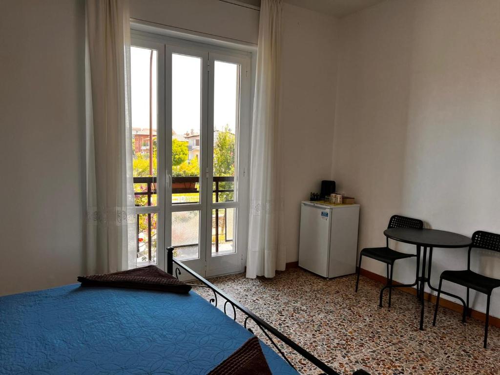 Postel nebo postele na pokoji v ubytování Camere Giulia