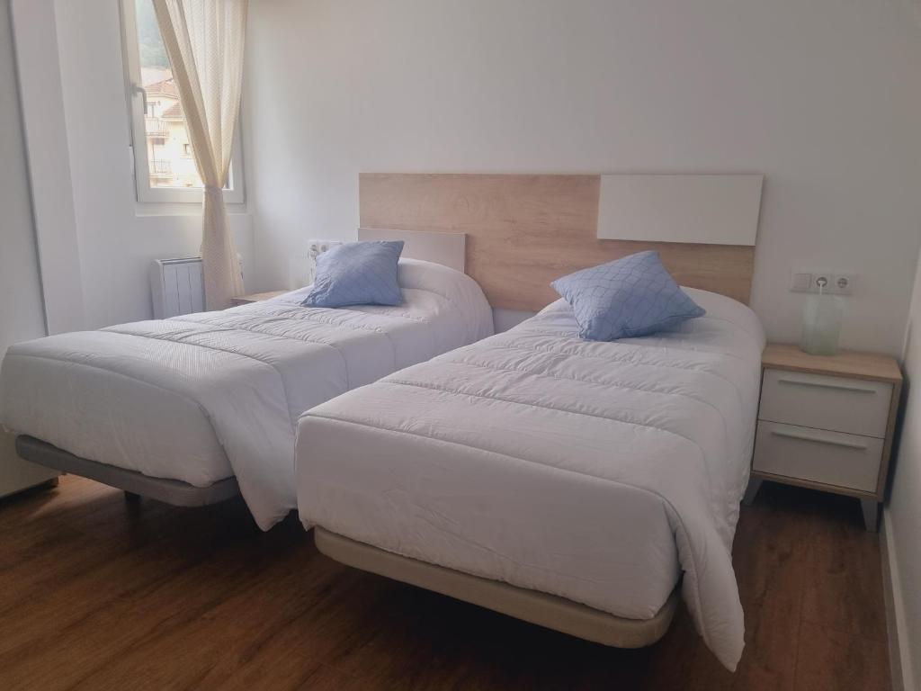 Postel nebo postele na pokoji v ubytování Maile Apartamentos
