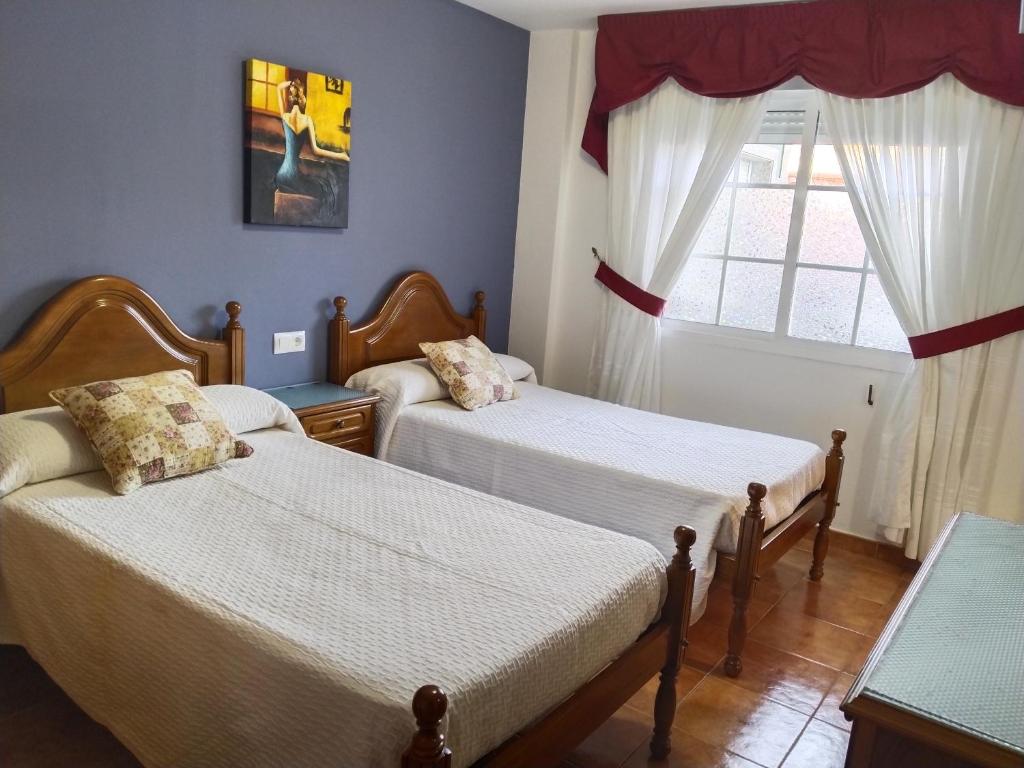 Posteľ alebo postele v izbe v ubytovaní Casa Los Geranios