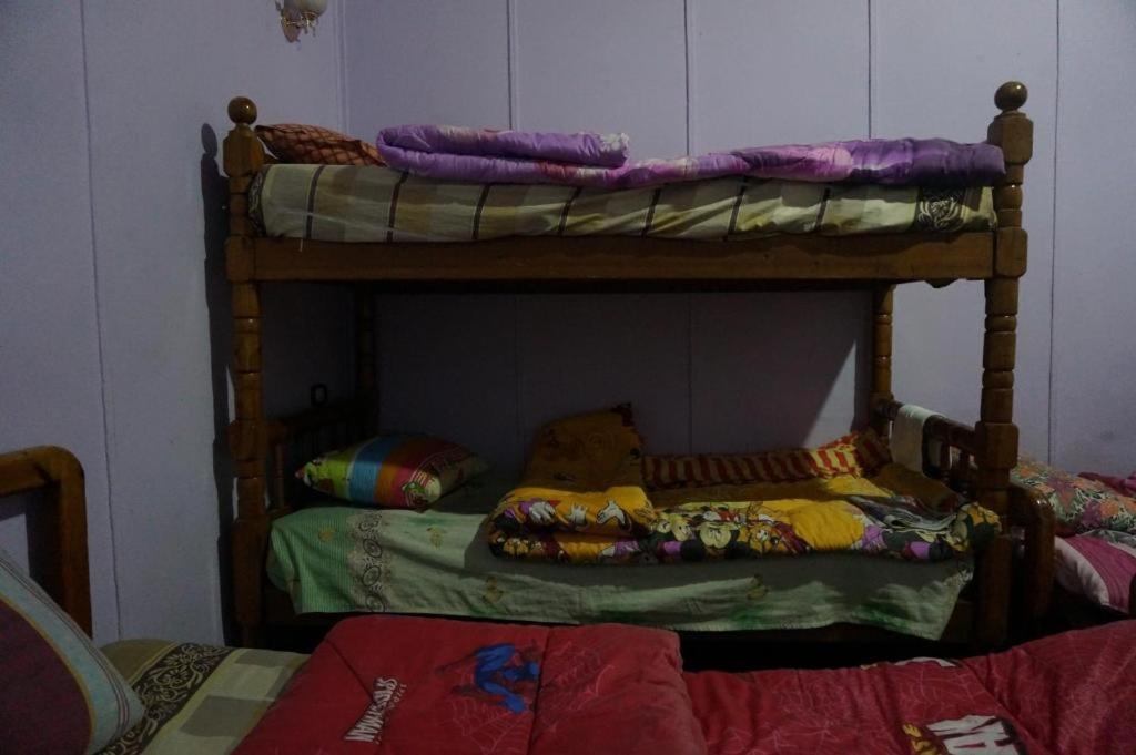 Postel nebo postele na pokoji v ubytování Safary Hotel