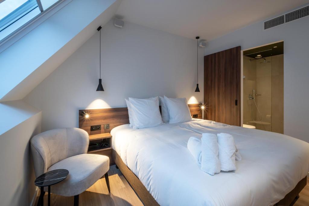 Postel nebo postele na pokoji v ubytování ONE TWO FOUR - Hotel & Spa