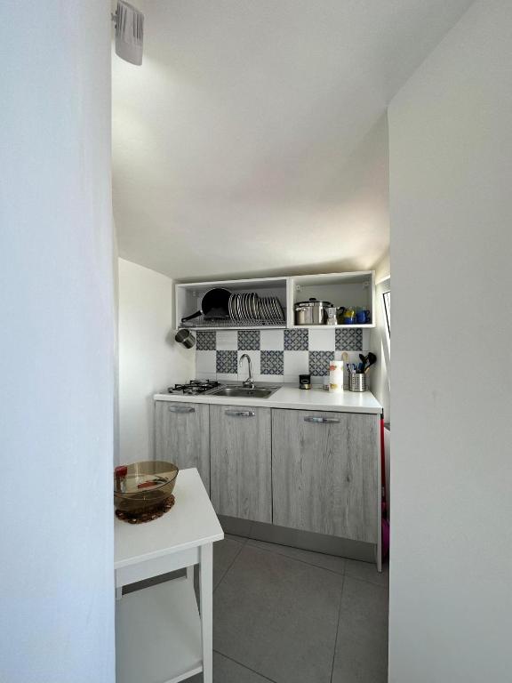 A kitchen or kitchenette at Matarazzo Rooms