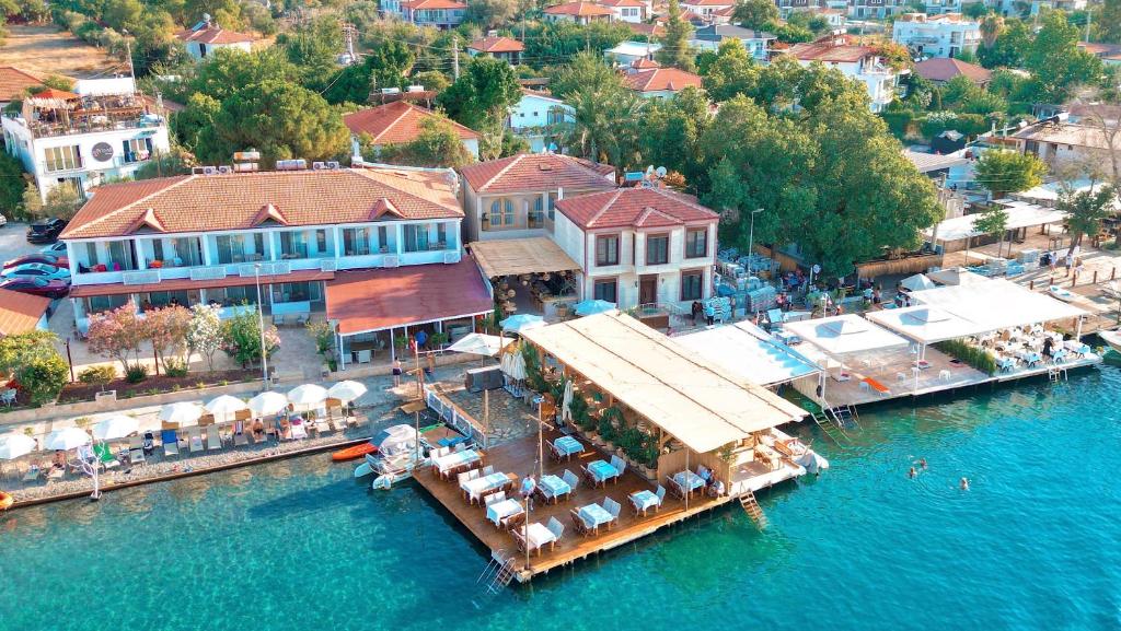 an aerial view of a resort on the water at Felix Rooms in Selimiye