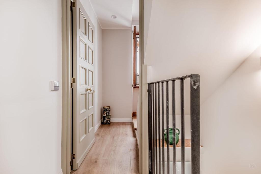 a hallway with a door leading into a room at APT ROME - Vittoria Palace in Rome