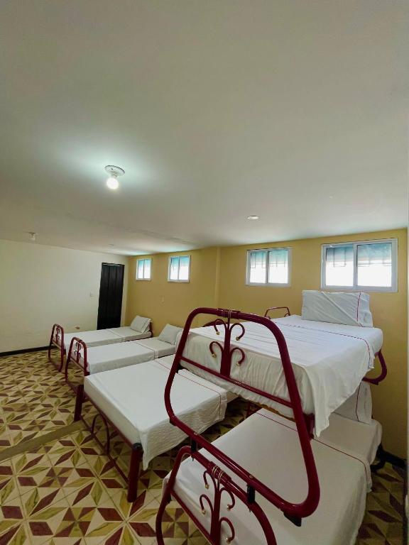 Postel nebo postele na pokoji v ubytování Hotel Los Balcones