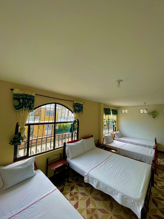 Postel nebo postele na pokoji v ubytování Hotel Los Balcones