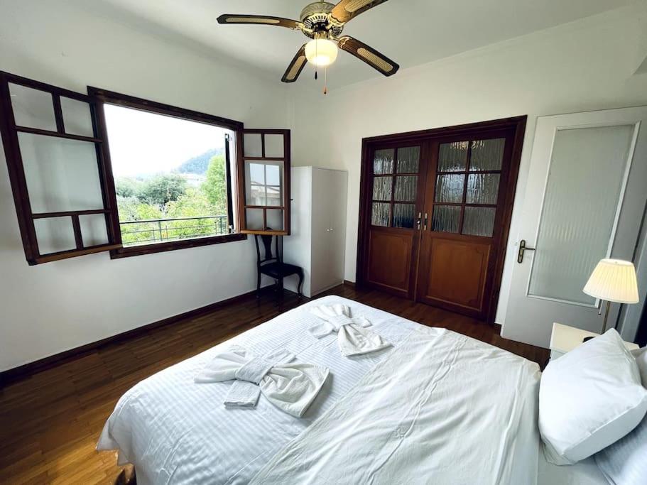 Postel nebo postele na pokoji v ubytování Orange Blossom Villa