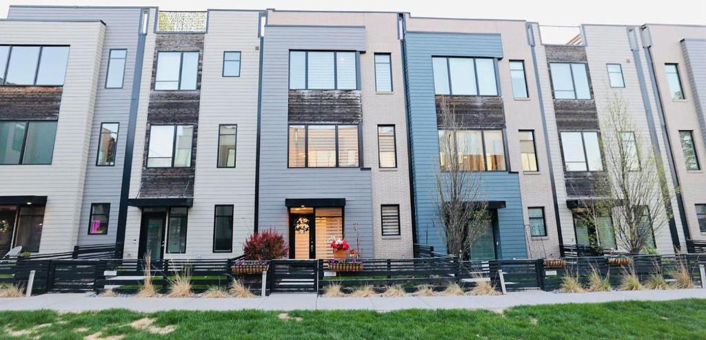 a large apartment building with blue and white at Modern Townhome Near Downtown with Amazing Views in Omaha