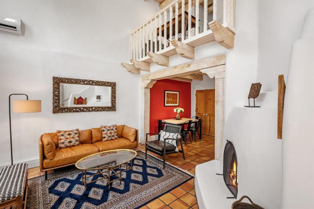 a living room with a couch and a table at Casa Anita in Santa Fe