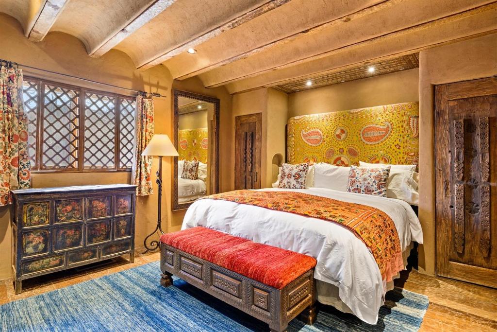 a bedroom with a large bed and a large window at Artesano in Santa Fe