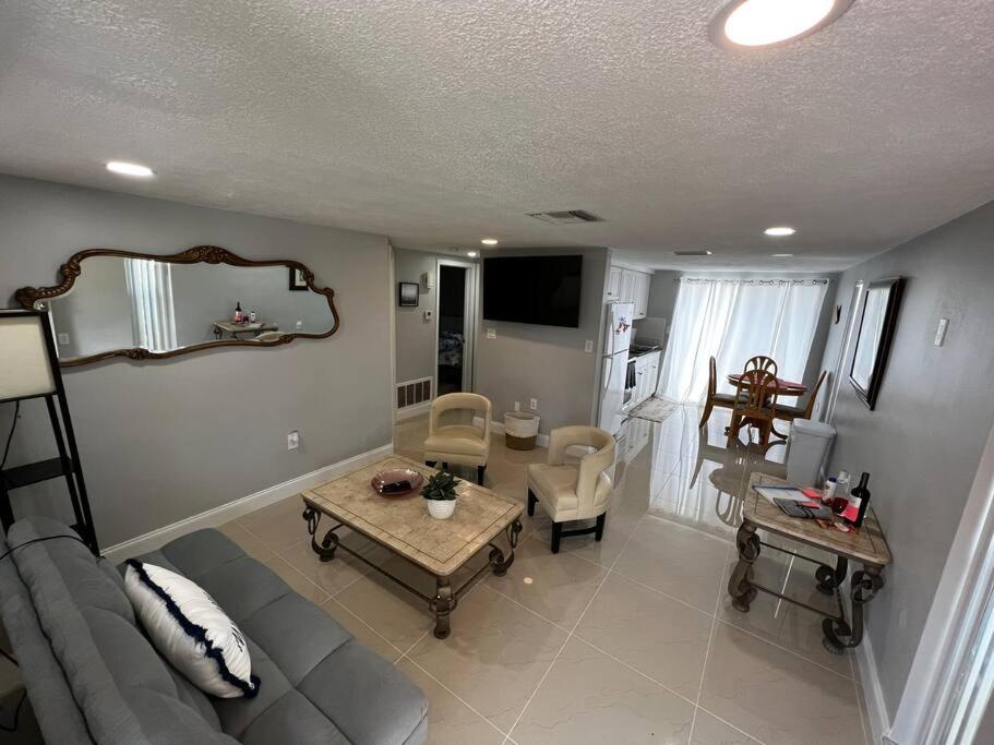 a living room with a couch and a table at Comfy 2 bedroom apartment in Port Richey