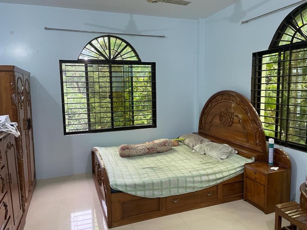 a bedroom with a bed with two pillows on it at Dream house in Atgaon