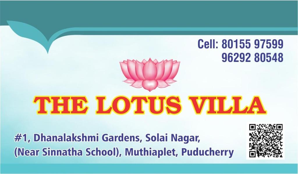 a sign for the lotus villa with a pink flower at The Lotus Villa in Kottakupam
