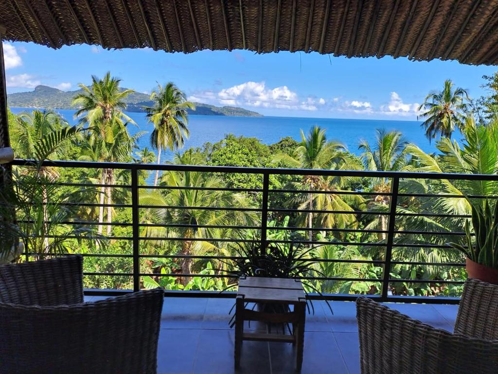 a view of the ocean from a resort balcony at LE CHISSIOUA in Sada