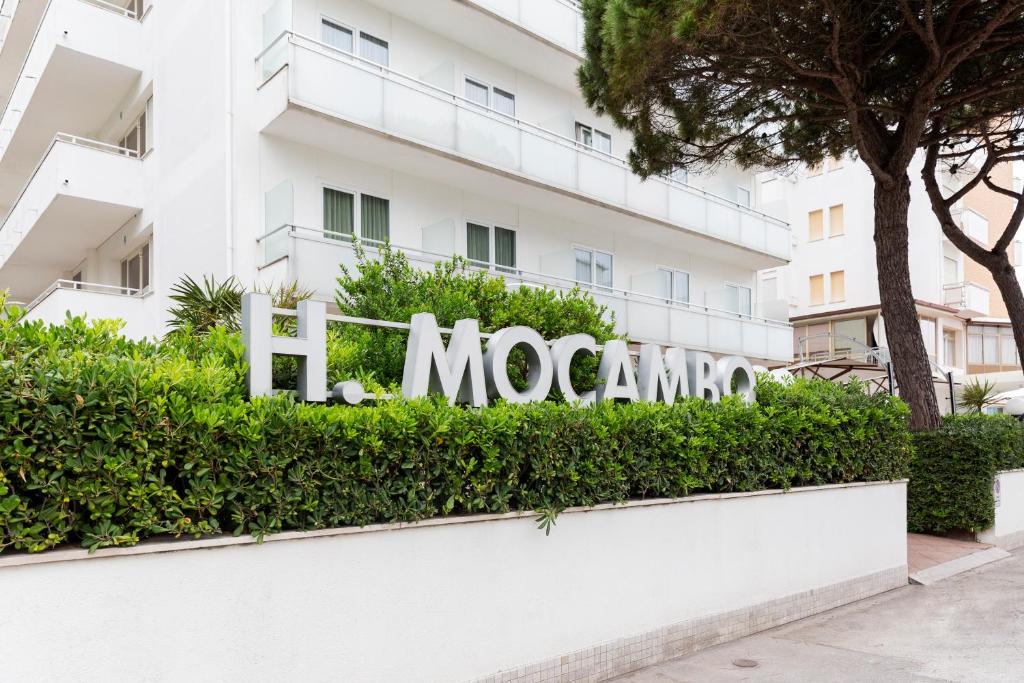 a sign in front of a building at Hotel Mocambo in Milano Marittima