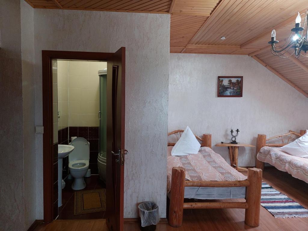 Postel nebo postele na pokoji v ubytování Pyate Koleso