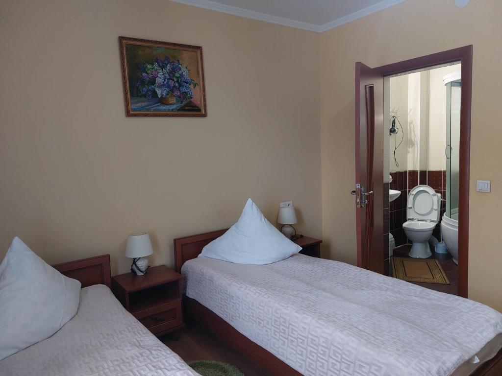 Postel nebo postele na pokoji v ubytování Pyate Koleso