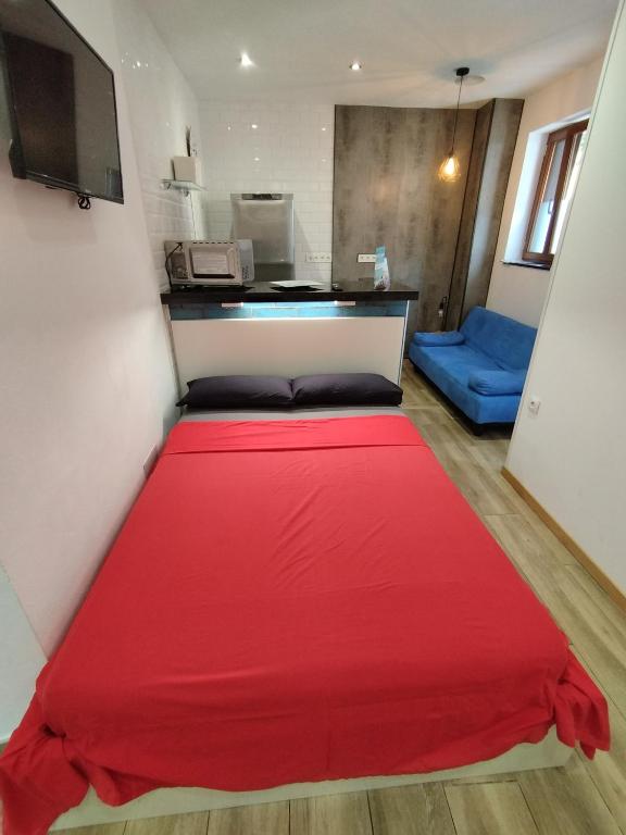 Posteľ alebo postele v izbe v ubytovaní Altozano Room III, Estudió centro de Málaga Gayfriendly, Wi-Fi gratis