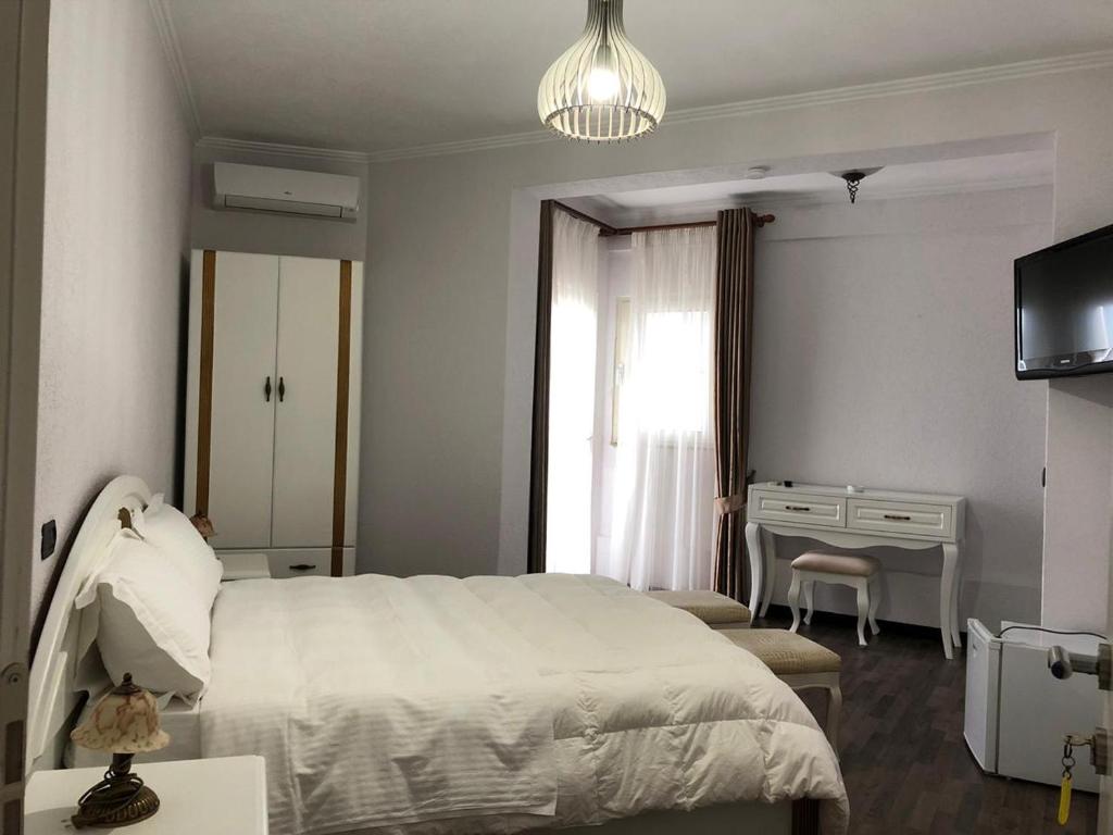 Postel nebo postele na pokoji v ubytování Hotel Majestic