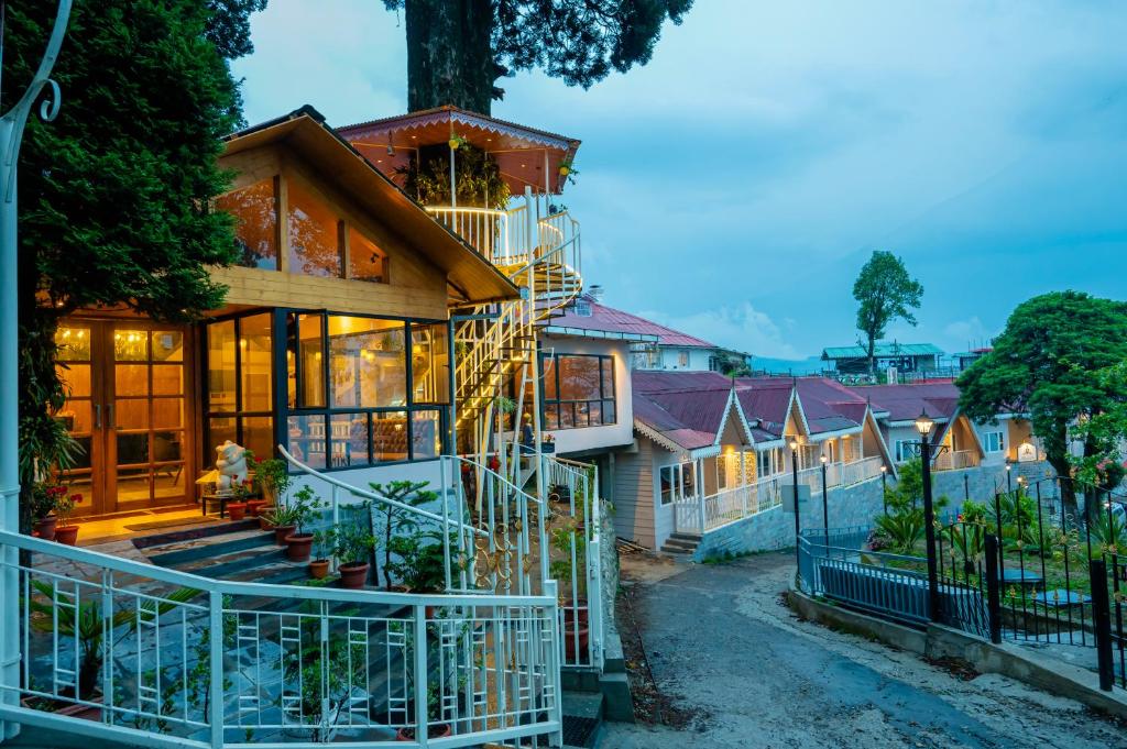 a house with a staircase up the side of it at Arcadia Heritage Resort in Darjeeling