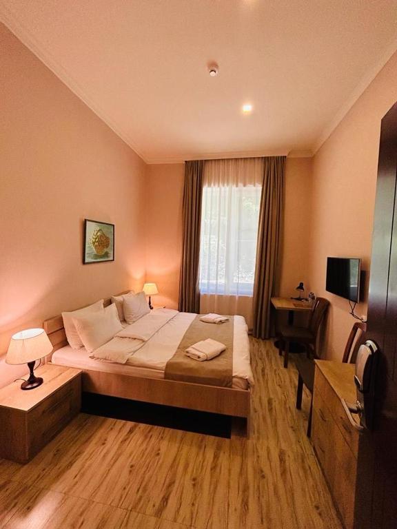 Postel nebo postele na pokoji v ubytování Abastumani Residence